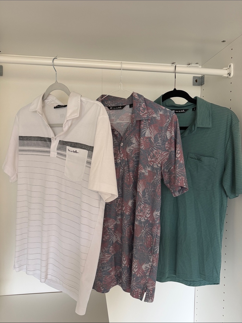 Travis Mathew Trio: White Stripe, Floral Slate, and Teal Pocket Polos